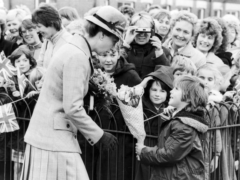 Sarah Hames, aged eight, from Hyde Park First School presents Princess Anne with a posy when she visited Sheffield on September 25, 1984