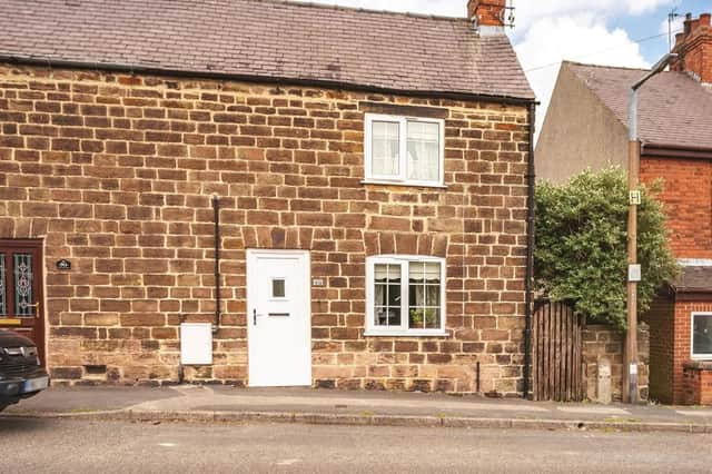 The property is a two-bedroom, semi-detached, stone-built cottage.