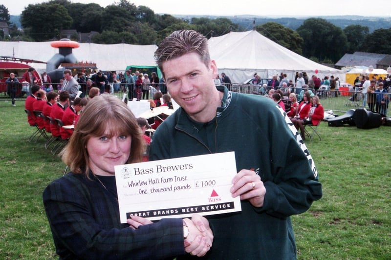 Sheffield Wednesday player Chris Waddle receives a £1,000 cheque for Whirlow Hall Farm at the fair, September 18, 1994