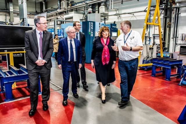 Keith Ridgway, right, on a tour of the AFRC facilities in Glasgow with, second left, Sir Martin Donnelly, President of Boeing Europe and Managing Director of Boeing UK and Fiona Hyslop MSP, Cabinet Secretary for Economy, Fair Work and Culture.