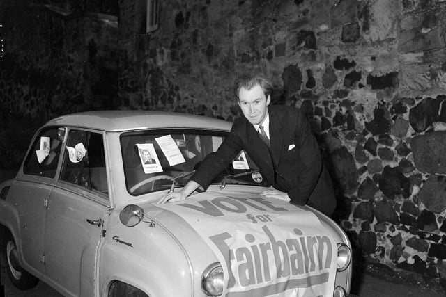 Nicholas Fairbairn campaigning for the Conservatives with a poster on his Goggomobil car during the Craigmillar by-election in November 1959.