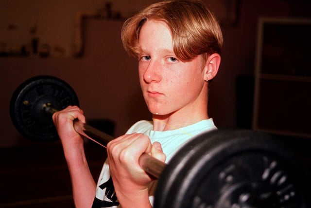 Jordan MItchell lifting weights at King Edward VII School in Sheffield in 1998