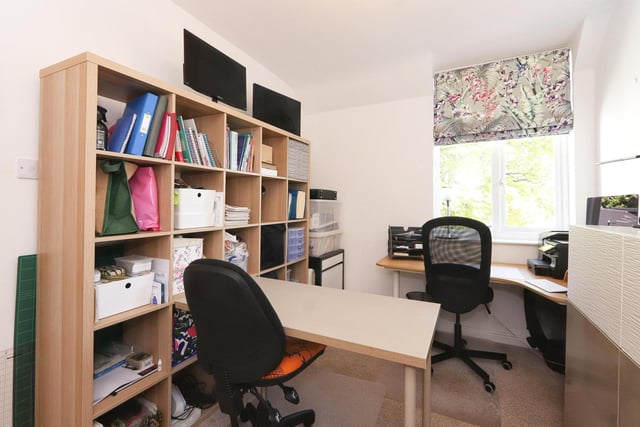 This bedroom is currently used as an office and offers a flexible space.