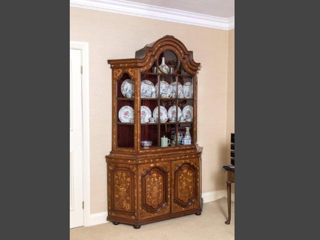 A Dutch walnut and marquetry display cabinet carries an estimate of £800-£1,200 (photo: James Pembrey)