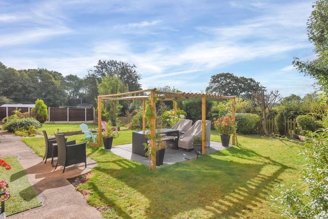 The home is surrounded by garden and paddock land, which are enclosed by established hedgerows with far reaching views.