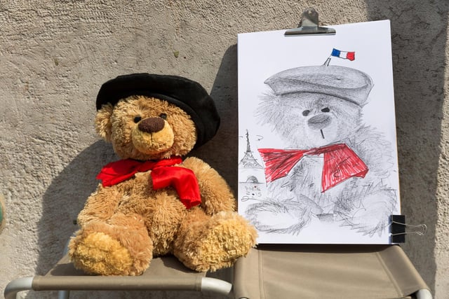 John James the teddy bear having a sketch done in Paris, France.
These adorable teddy bears could be the world's most well-travelled cuddly toys - as their photographer owner has chronicled their adventures in 27 different countries. Christian Kneidinger, 57, has been travelling with his teddy bears, named John and Bob since 2014 - and his taken them to some of the world's most famous landmarks. The teddy bears have dressed up in traditional Emirati clothing to visit the Sultan's Palace in Oman, and have braved the cold on a glacier on Lofoten Island in Norway.