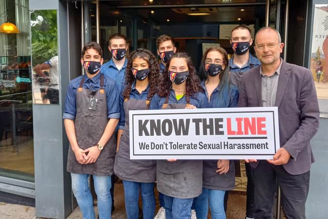 Revolution Bar staff and Paul Blomfield with the Know The Line poster.