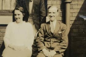 Thomas Douglas Peck (back) and his parents