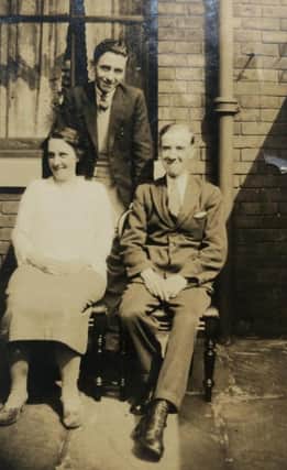 Thomas Douglas Peck (back) and his parents