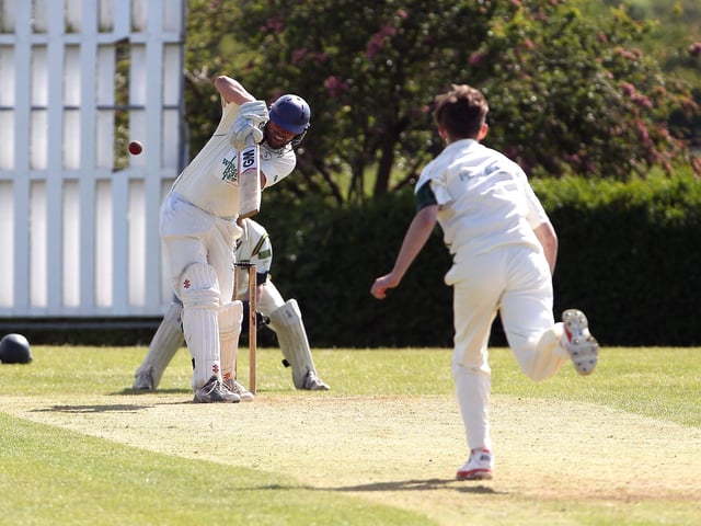Lea Park bowler Jim Roberts bowls at Farnsfield's Anthony Moore, who hits the ball high and is caught out, on 6th June 2015.