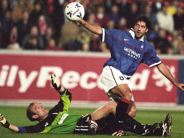 Who is trying to get the better of Jim Leighton here?