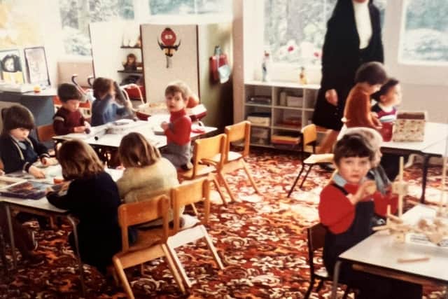 Sister Aquinas in 1982 with 'Nursery 2' children in the old infant block, now replaced by a modern Early Years Centre