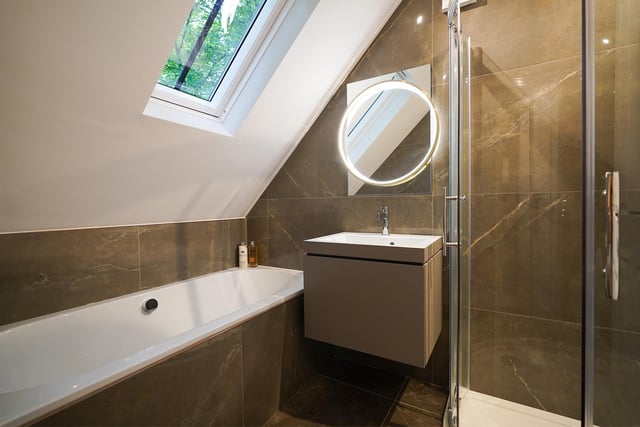 Both en-suites are beautifully finished. This particular en-suite has a rounded shower in the corner of the room.