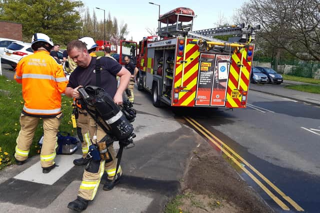 Two people leaped to safety from the upstairs window of a blazing Sheffield flat after a fire broke out today at Firshill Grove, Shirecliffe, near the Sheffield United training ground. Pictured are firefighters at the scene