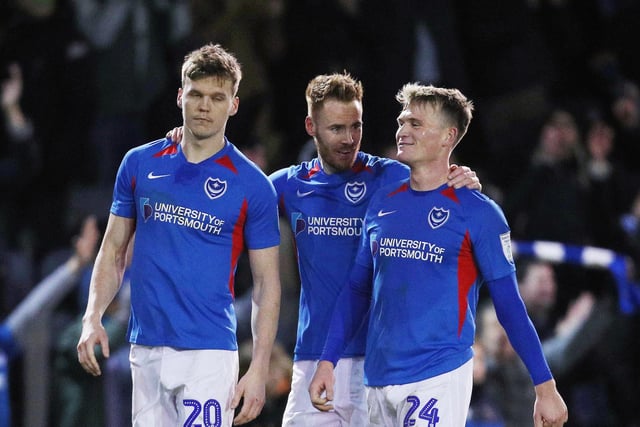 Portsmouth's Sean Raggett, Portsmouth's Tom Naylor and Portsmouth's Cameron McGeehan at the end of the match