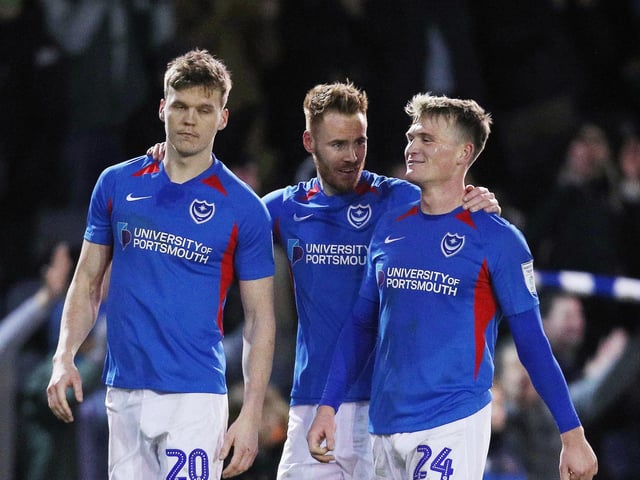 Portsmouth's Sean Raggett, Portsmouth's Tom Naylor and Portsmouth's Cameron McGeehan at the end of the match