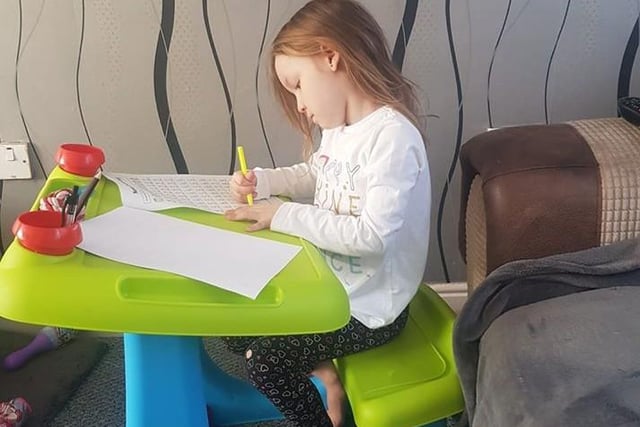 A studious Ava, four, of Stanhope Primary School.