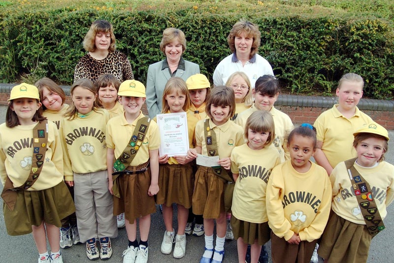 Kirkby Brownies presenting a cheque to the Lincs and Notts Air Ambulance in 2001