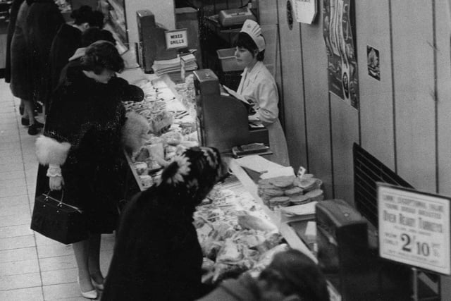 The sign says over ready turkeys are just two and ten at Woolworths in King Street. Remember this from 1966?