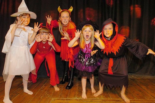 Halloween kids prowl the stage as part of the fashion show to raise funds for Amy's House in Handsworth, October 2005
