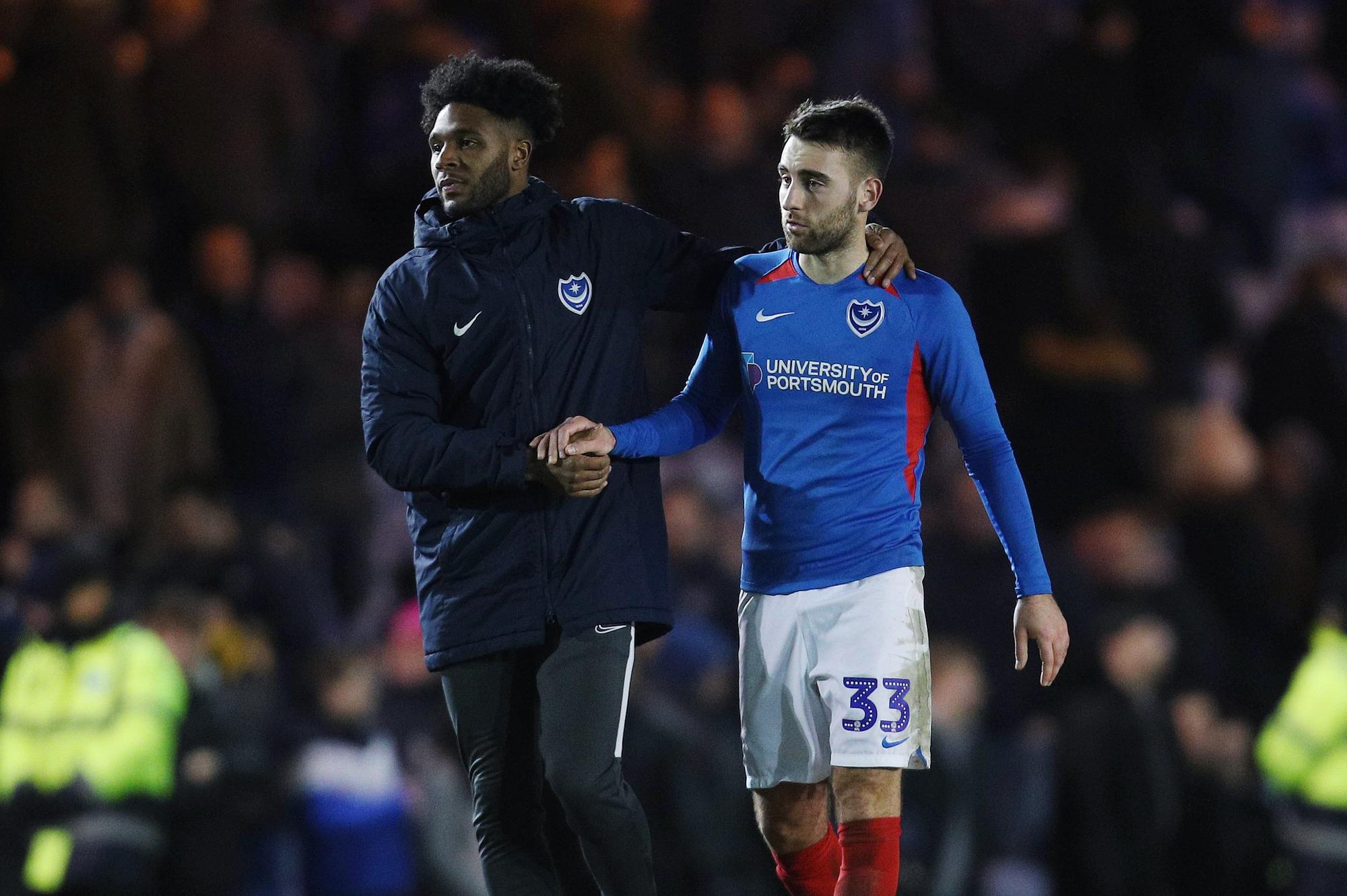 Portsmouth's Ellis Harrison and Portsmouth's Ben Close dejected after the match