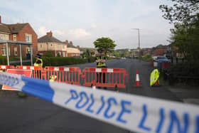 Police officers at the scene in Grimethorpe after more than 100 homes were evacuated in the former pit village after an Army bomb squad was deployed in the wake of a police operation. South Yorkshire Police has now confirmed the cordon has been reduced to just three houses. Photo credit: Danny Lawson/PA Wire