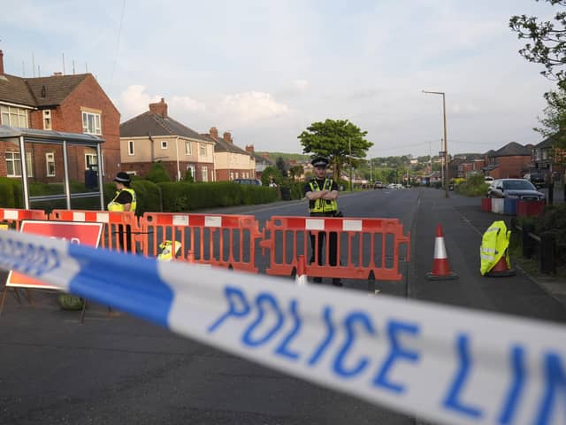 Police officers at the scene in Grimethorpe after more than 100 homes were evacuated in the former pit village after an Army bomb squad was deployed in the wake of a police operation. South Yorkshire Police has now confirmed the cordon has been reduced to just three houses. Photo credit: Danny Lawson/PA Wire