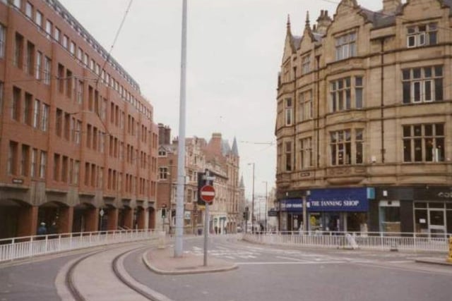 The junction of Church Street and Leopold Street in Sheffield city centre, showing The Tanning Shop