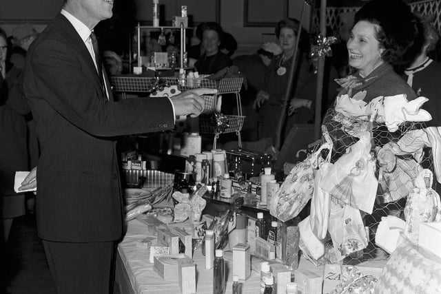 The Duke of Edinburgh attends the Christmas Market, held in the Assembly Rooms on George Street in 1965.
