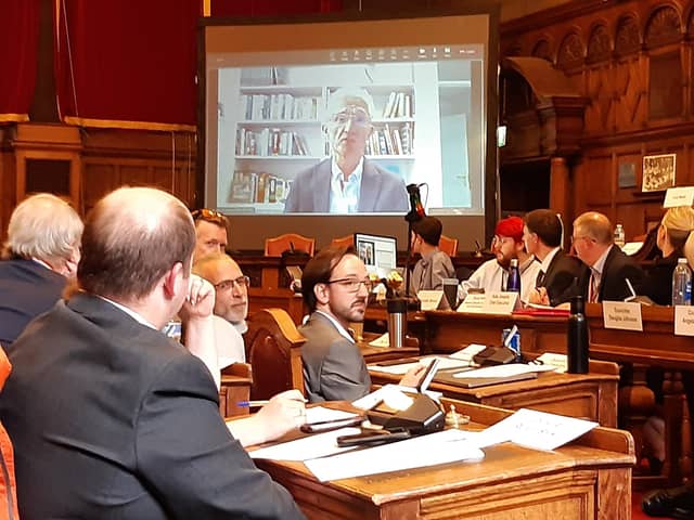 Members of Sheffield City Council watch on screens as chair of the independent inquiry into the city street trees scandal, Sir Mark Lowcock, addresses an extraordinary council meeting to discuss the report's findings. Picture: Julia Armstrong, LDRS