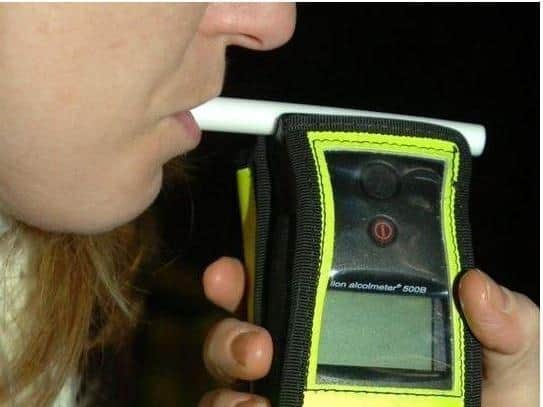 A drink-driver was caught by police after he had gone out to pick his wife up from the cold.