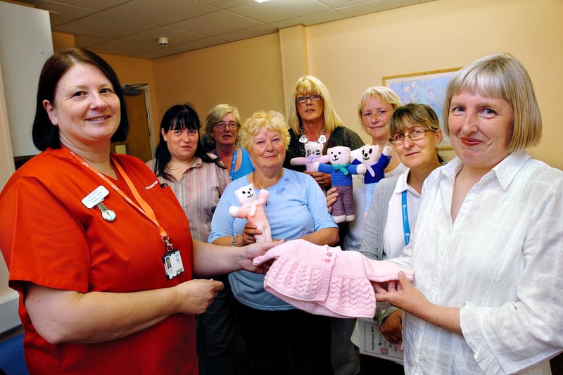 Sunderland Royal Hospital Nursery Nurse Sue Harvey accepts the gifts of knitwear from Maureen Davidson and members of the Knit and Natter group from Sunderland MIND. Were you pictured 10 years ago?