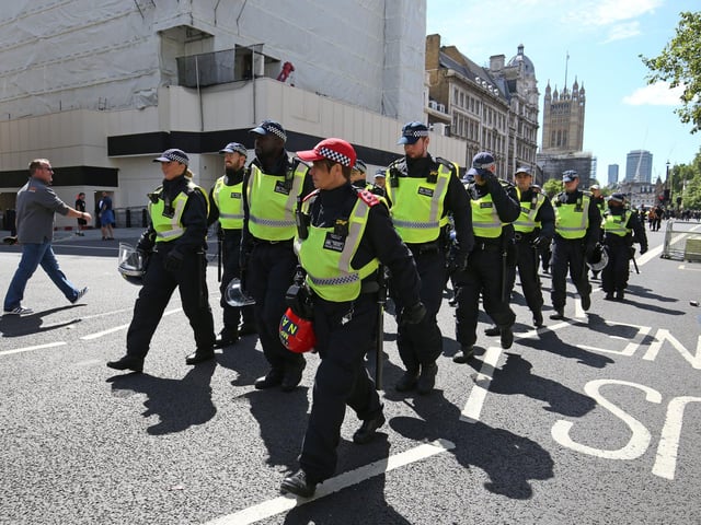 Police arrive. Jonathan Brady/PA Wire