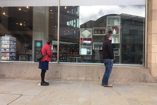 As they waited to get in, shoppers looked through the windows to see what was on offer