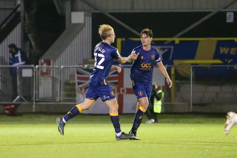 George Lapslie briefly celebrates his goal with team mate James Clarke.
