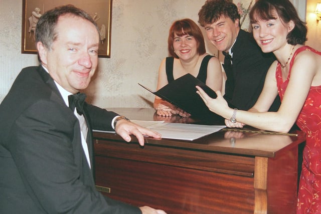 Keith Roe seated at piano with singers Joanne Patterson,Gary St John and Sarah Buckley back in 1999