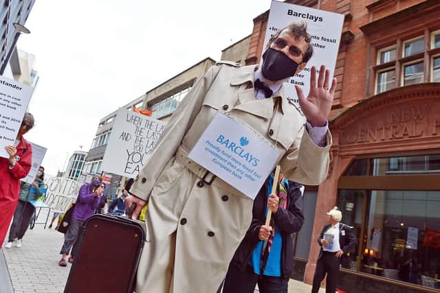 A protester dressed as a banker at an Extinction Rebellion Bankers' Tea Party protest in Sheffield.