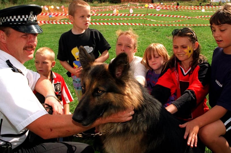 Children from the Flower Estate meeting Police Dog Zeus and PC Kevin Godley at the Family Fun Fair in Wincoban in 1997