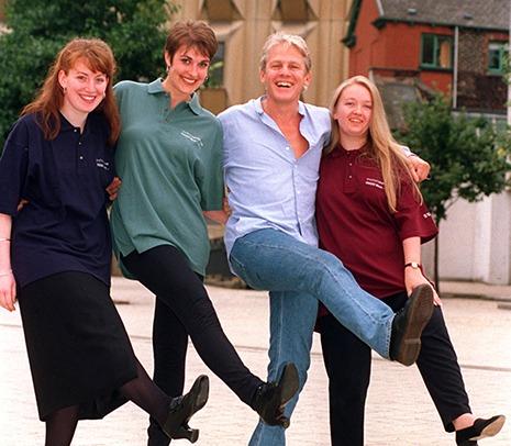 Actor Paul Nicholas joins Joanne Crooks, Karen Locke and Helena Burnand with new T-shirts from the Cues Shop at the Crucible Theatre on September 3, 1996