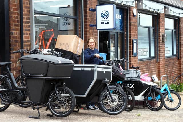 A Different Gear shop manager Tori Gray with some of the shop's e-cargo bikes