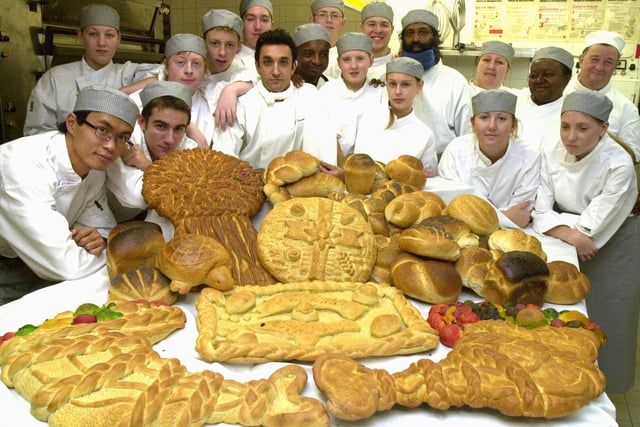 Tutor Chris North and Jose Fernandez pictured with 1st Year Bakery students at the Sheffield College  with bread they have baked for the traditional Harvest festival at the Sheffield Cathedral in 2003