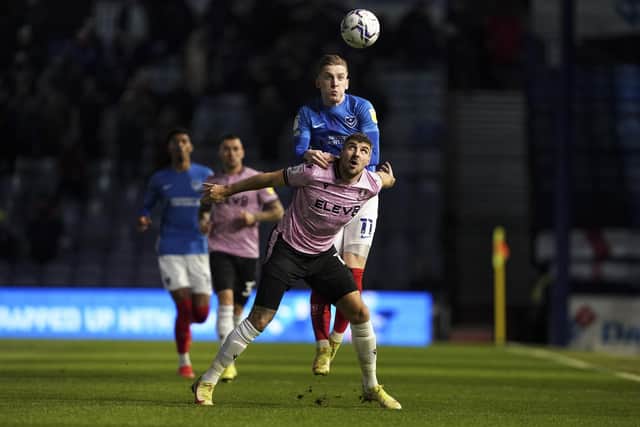 Callum Paterson battles for a ball with Ronan Curtis during Sheffield Wednesday's clash at Portsmouth.