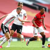 Anthony Martial gets away from Sander Berge and Chris Basham during Manchester United's win over Sheffield United