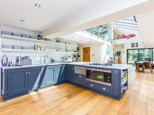 This bright open space has large full length sliding doors across two walls, skylight which runs the length of the dining area and gallery above.