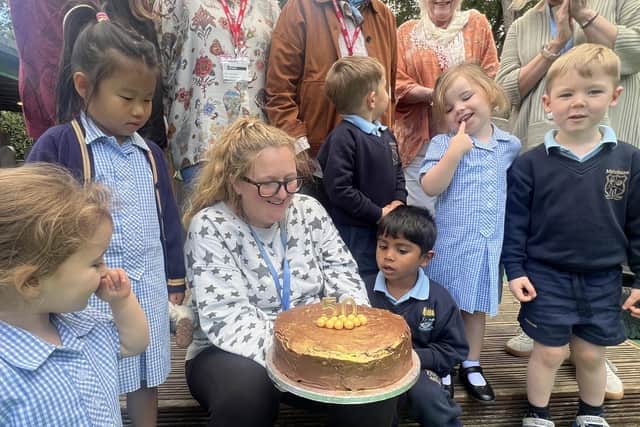 Valerie Clarke with the 50th anniversary cake
