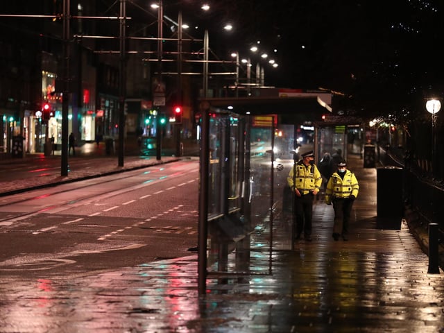 Police patrol a quiet Princes Street. Photo credit: Andrew Milligan