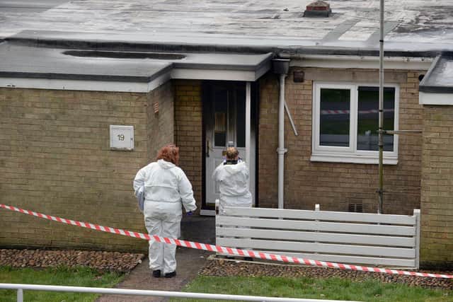 Officers inspect the aftermath of the fire at Grindlow Close in Heeley, Sheffield. Pic Steve Ellis