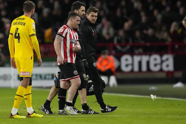 A frustrated John Fleck of Sheffield United leaves the pitch injured during his team's meeting with Rotherham at Bramall Lane: Andrew Yates / Sportimage