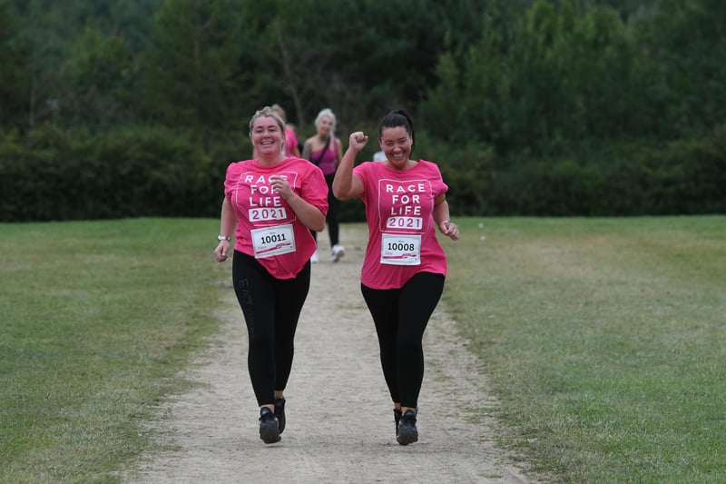 Two runners enjoy taking part in the Race for Life at Herrington Country park, on Sunday.