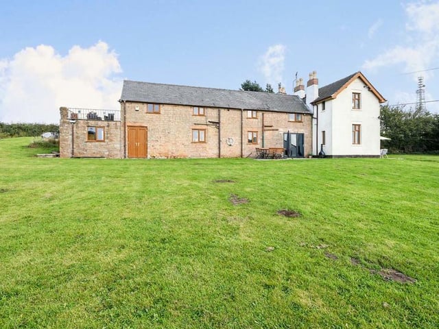 Let's move outside now and take a look at the expansive grounds of Halfmoon Farm. This is a view from the rear of the farmhouse from its sprawling grassland.